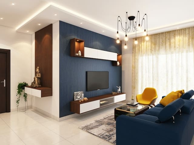a living area with navy and yellow accents