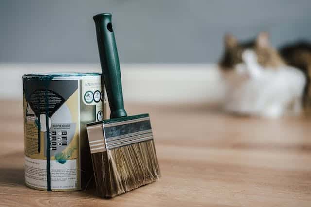 paint-brush-leaning-against-can-of-paint