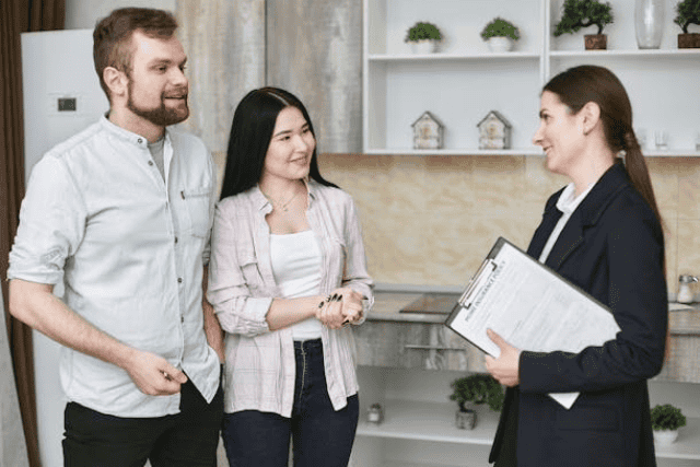 a-landlord-speaking-with-two-prospective-tenants